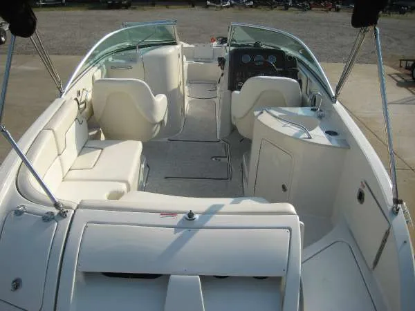 Slide: The Image of Interior of a 2008 Sea Ray 260 Sundeck boat with white seating. - 6
