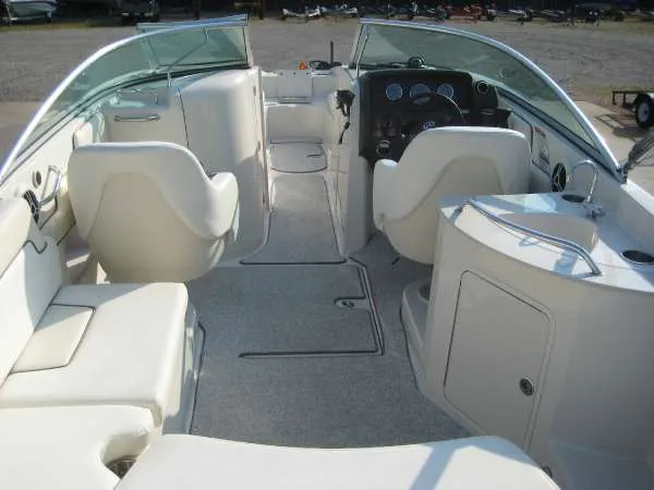 Slide: The Image of Interior of a 2008 Sea Ray 260 Sundeck boat with white seating. - 7