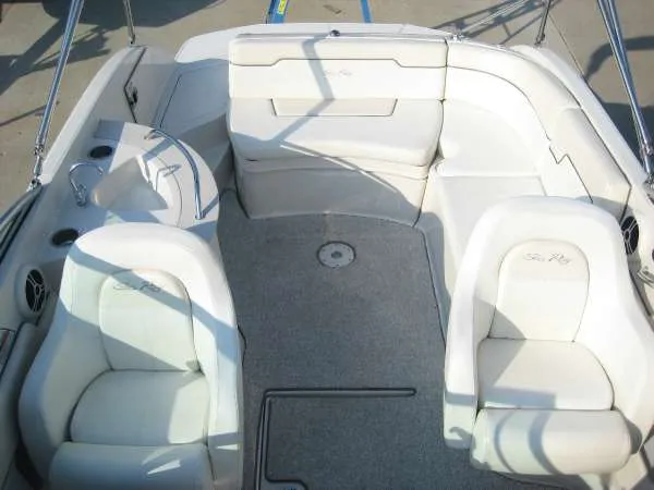 Slide: The Image of Interior of a 2008 Sea Ray 260 Sundeck boat with white seating. - 8