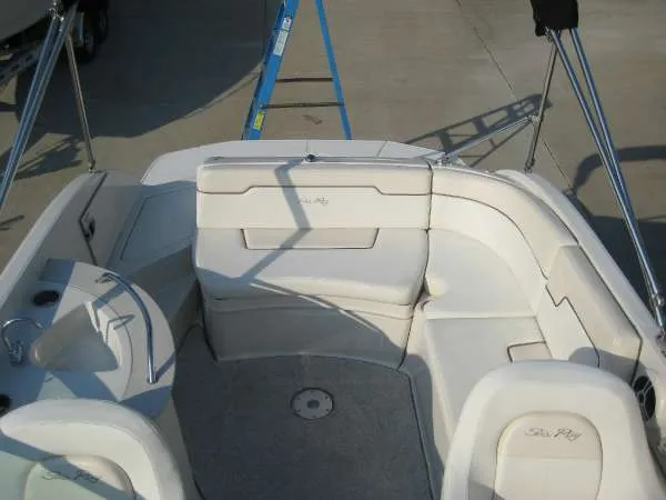 Slide: The Image of Interior of a 2008 Sea Ray 260 Sundeck boat with white seating. - 9
