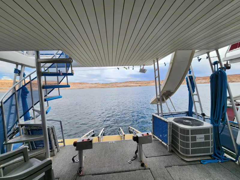 Slide: The Image of 2008 Sumerset Blue Moon Share #12 houseboat with spiral staircase and slide on a serene lake. - 17