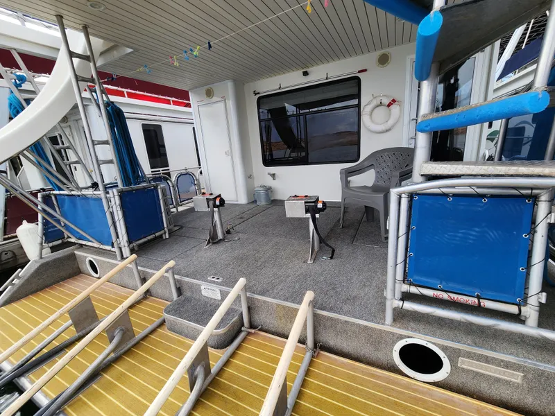 Slide: The Image of 2008 Sumerset Blue Moon Share #12 houseboat deck with seating, slide, and safety equipment. - 21
