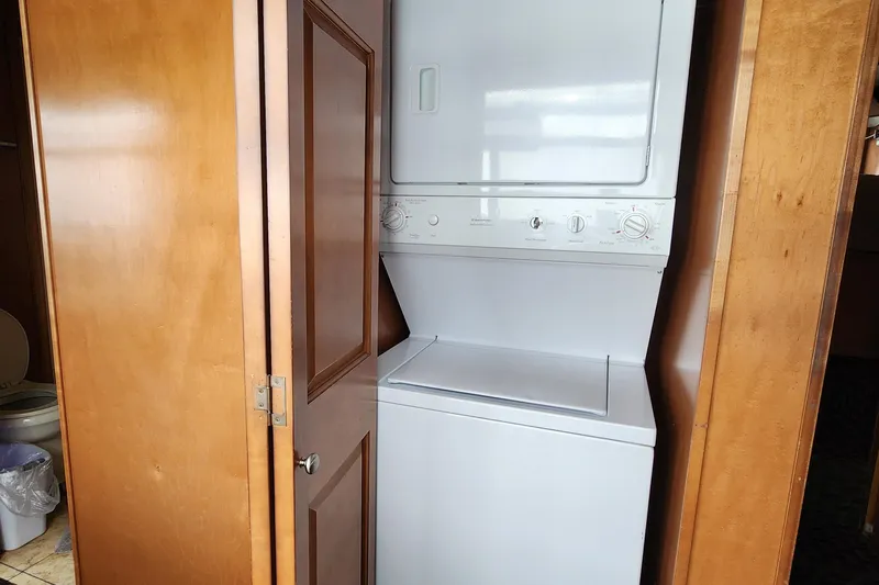 Slide: The Image of Stacked washer and dryer in wooden cabinet, Sumerset Blue Moon Share #12, 2008. - 33