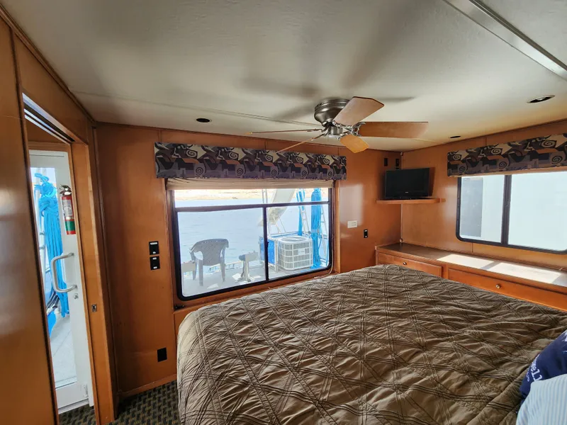 Slide: The Image of Cozy bedroom interior of 2008 Sumerset Blue Moon Share #12 houseboat with lake view. - 34