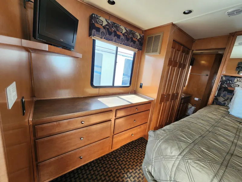 Slide: The Image of Interior of 2008 Sumerset Blue Moon Share #12 with wooden cabinetry and mounted TV. - 35