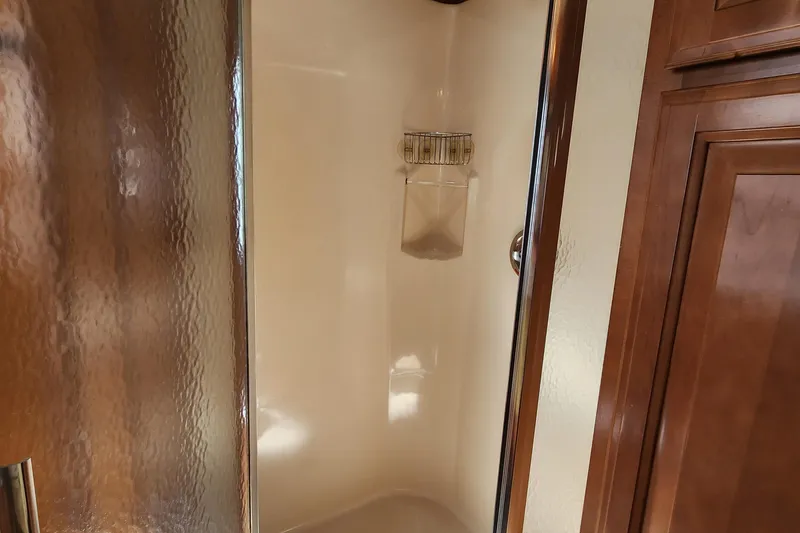 Slide: The Image of Shower area in 2008 Sumerset Blue Moon Share #12 houseboat with wooden cabinetry. - 38