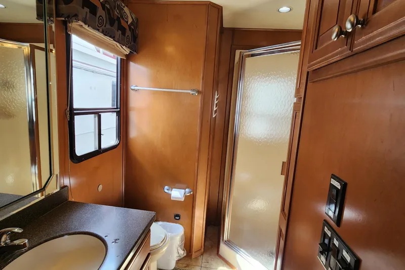 Slide: The Image of 2008 Sumerset Blue Moon Share #12 bathroom with wooden cabinets, shower, and sink. - 39
