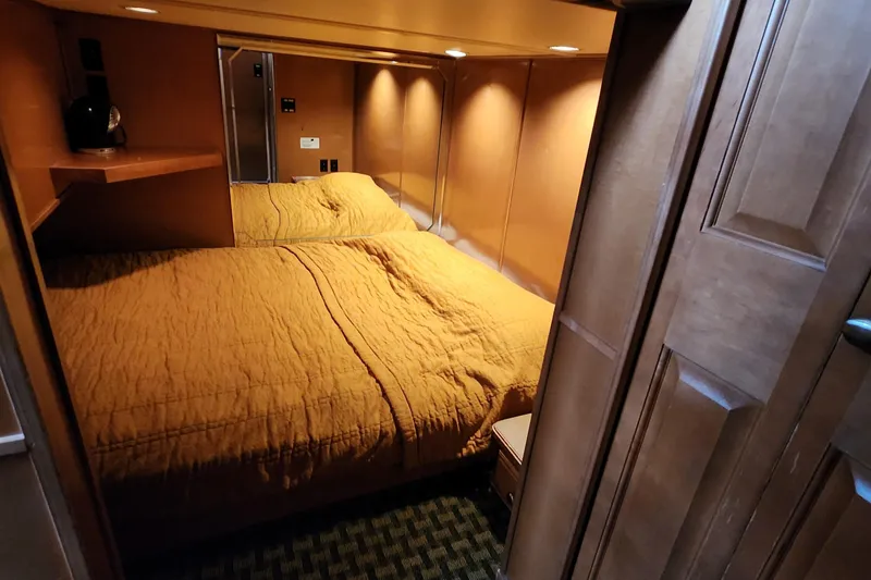 Slide: The Image of Cozy bedroom in 2008 Sumerset Blue Moon Share #12 houseboat with warm lighting and wood accents. - 41