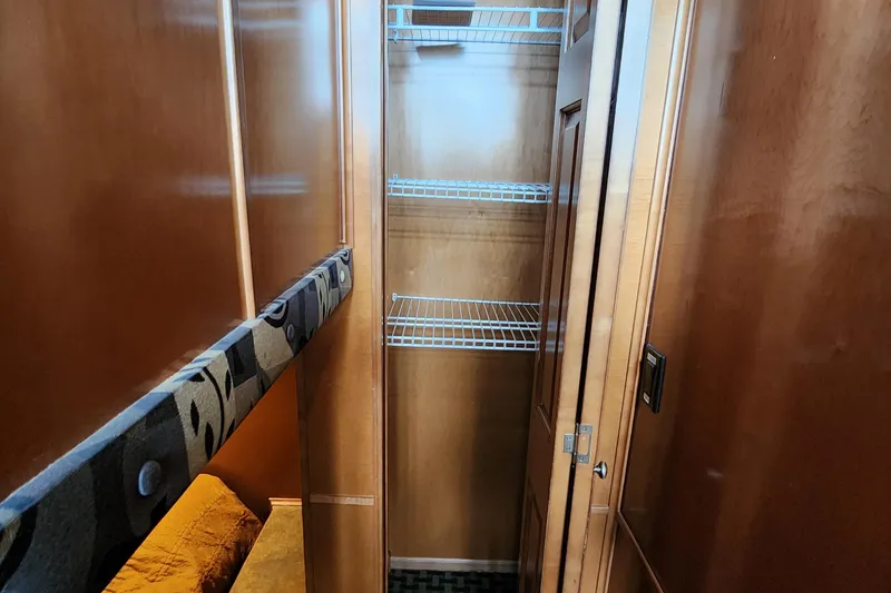 Slide: The Image of 2008 Sumerset Blue Moon Share #12 interior with wooden closet and wire shelving. - 42