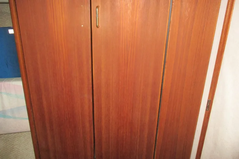 Slide: The Image of Wooden interior door on 1988 Bayliner 3888 Motoryacht, showcasing classic yacht design. - 17