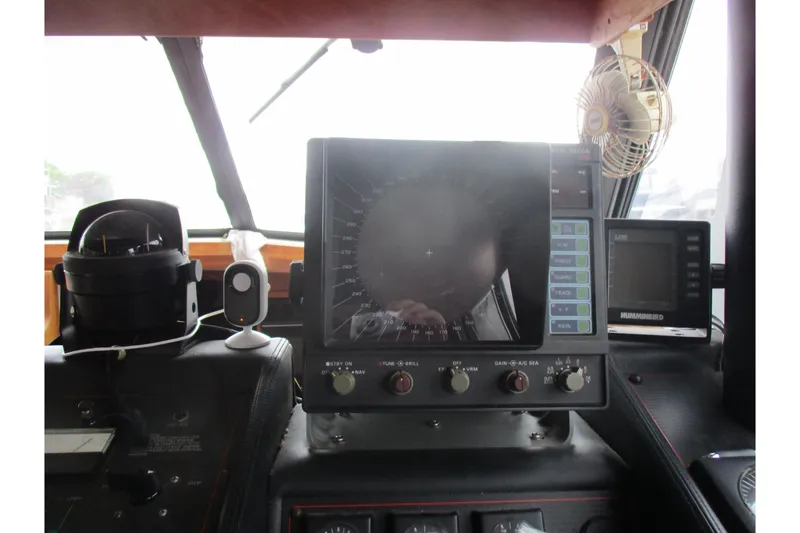 Slide: The Image of Dashboard of a 1988 Bayliner 3888 Motoryacht with navigation equipment and controls. - 27