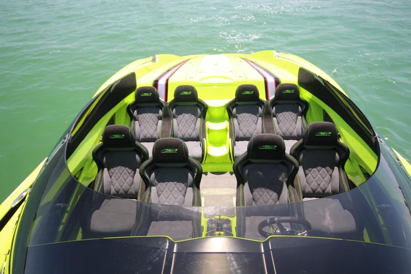Slide: The Image of 2025 MTI Marine Technology Inc 48 Pleasure boat with green and black seating. - 3