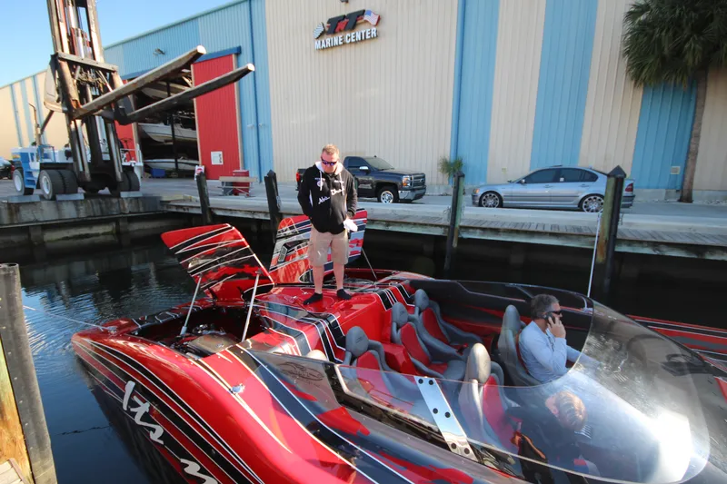 Slide: The Image of 2025 MTI Marine Technology Inc 48 Pleasure boat docked at a marina with people onboard. - 6