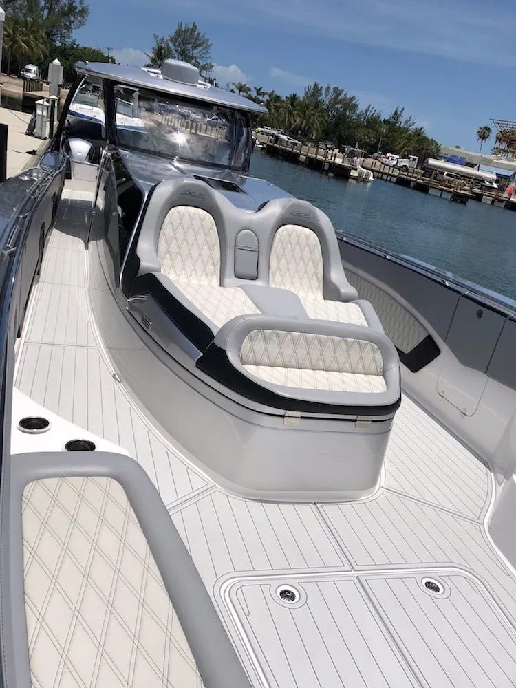 Slide: The Image of 2025 MTI V Marine Technology Inc V 57 luxury boat with white quilted seating. - 18
