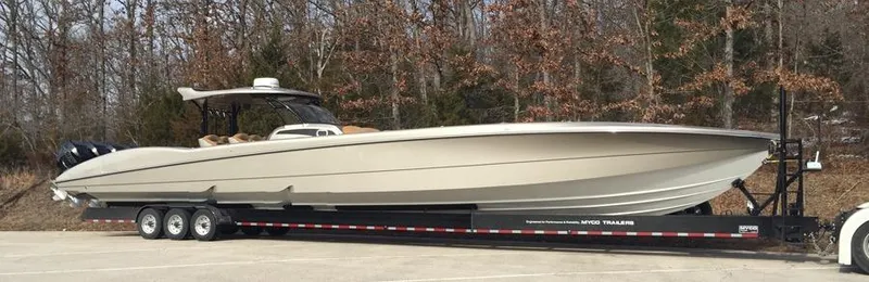 Slide: The Image of 2025 MTI V Marine Technology Inc V 57 boat on a trailer in a parking lot. - 6