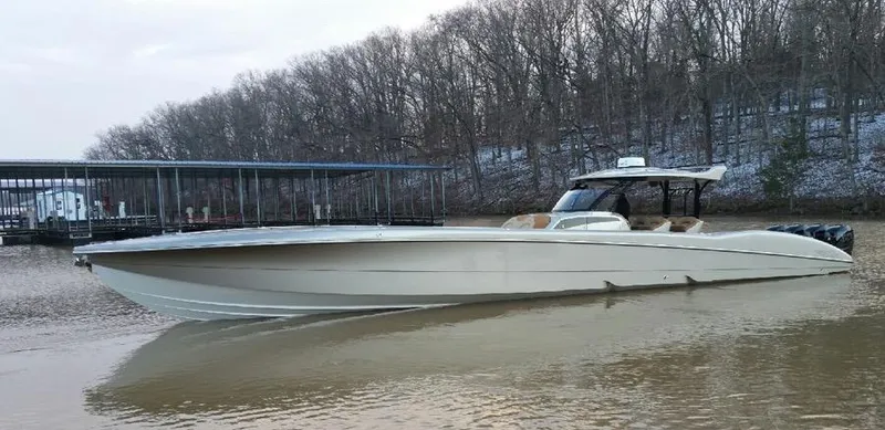 Slide: The Image of 2025 MTI V Marine Technology Inc V 57 boat on a calm lake. - 7