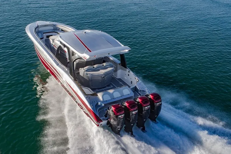 The Image of 2025 MTI V Marine Technology Inc V 42 boat cruising on water with four outboard engines. - 0