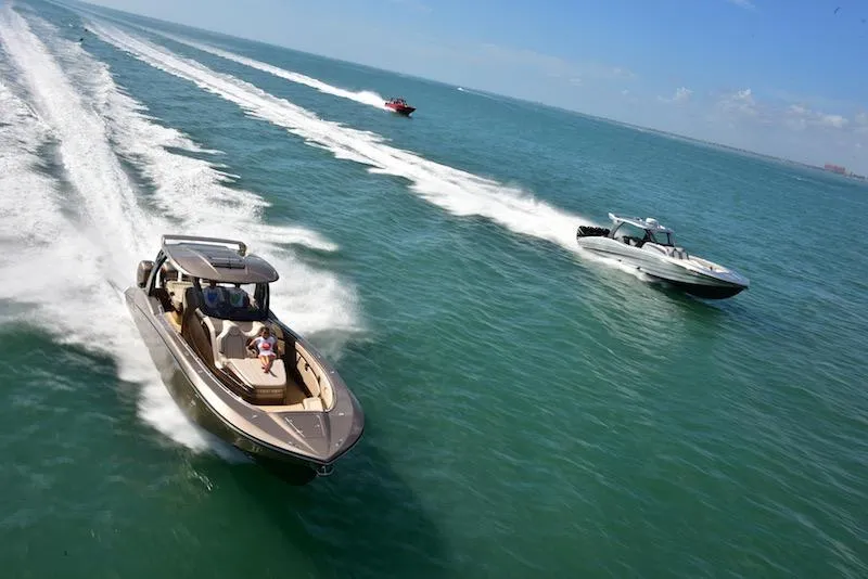 Slide: The Image of 2025 MTI V Marine Technology Inc V 42 boats cruising on open water. - 11