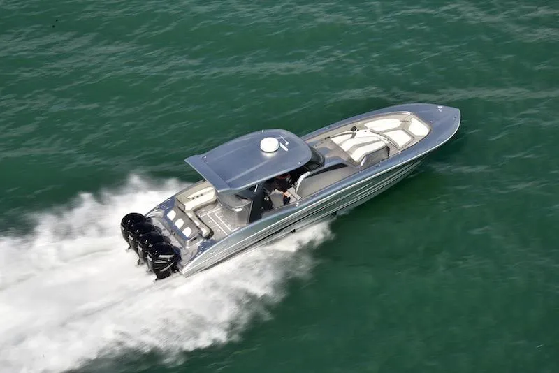 Slide: The Image of 2025 MTI V Marine Technology Inc V 42 speedboat cruising on open water. - 12