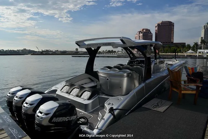 Slide: The Image of 2025 MTI V Marine Technology Inc V 42 boat docked with Mercury engines. - 14