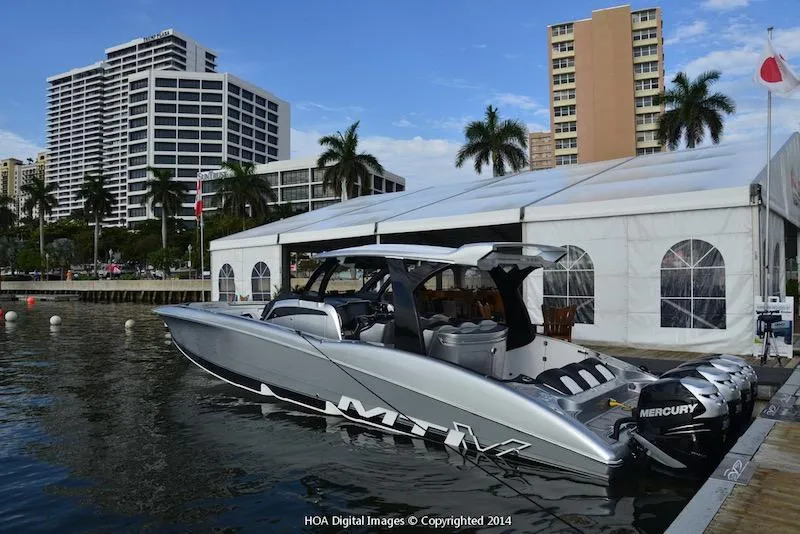 Slide: The Image of 2025 MTI V Marine Technology Inc V 42 boat docked near waterfront buildings. - 16