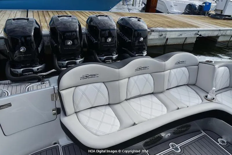 Slide: The Image of MTI V Marine Technology Inc V 42 2025 boat with quad outboard engines and luxury seating. - 17