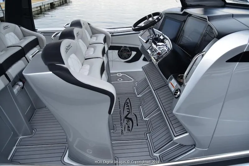Slide: The Image of Interior of 2025 MTI V Marine Technology Inc V 42 boat with modern seating and dashboard. - 18