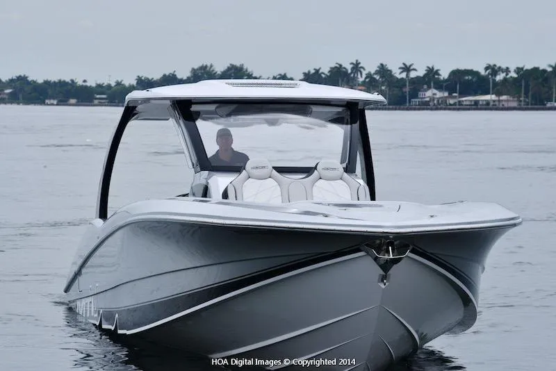 Slide: The Image of 2025 MTI V Marine Technology Inc V 42 boat on calm water. - 25