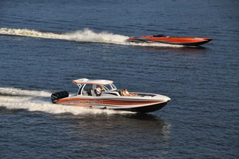 Slide: The Image of 2025 MTI V Marine Technology Inc V 42 boats cruising on water. - 26