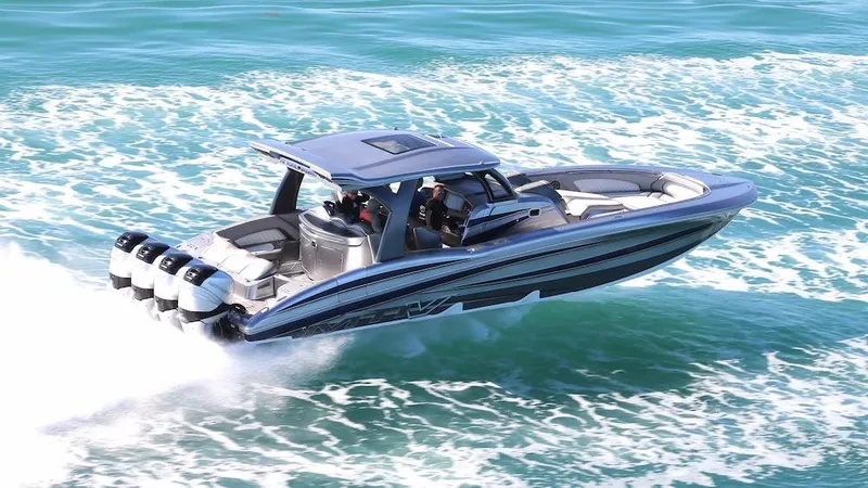 Slide: The Image of 2025 MTI V Marine Technology Inc V 42 speedboat cruising on the ocean. - 31