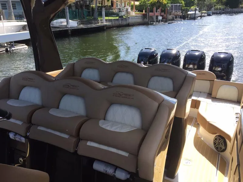 Slide: The Image of 2025 MTI V Marine Technology Inc V 42 boat with luxurious seating and powerful engines. - 34