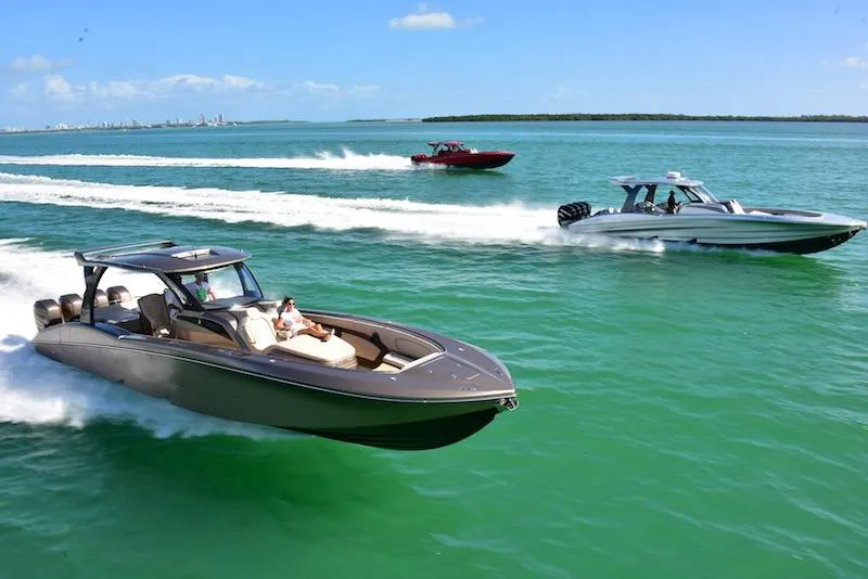 Slide: The Image of 2025 MTI V Marine Technology Inc V 42 boats cruising on clear blue water. - 6