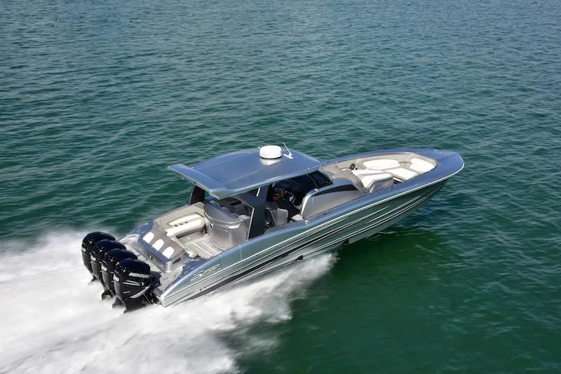 Slide: The Image of 2025 MTI V Marine Technology Inc V 42 boat cruising on open water. - 7