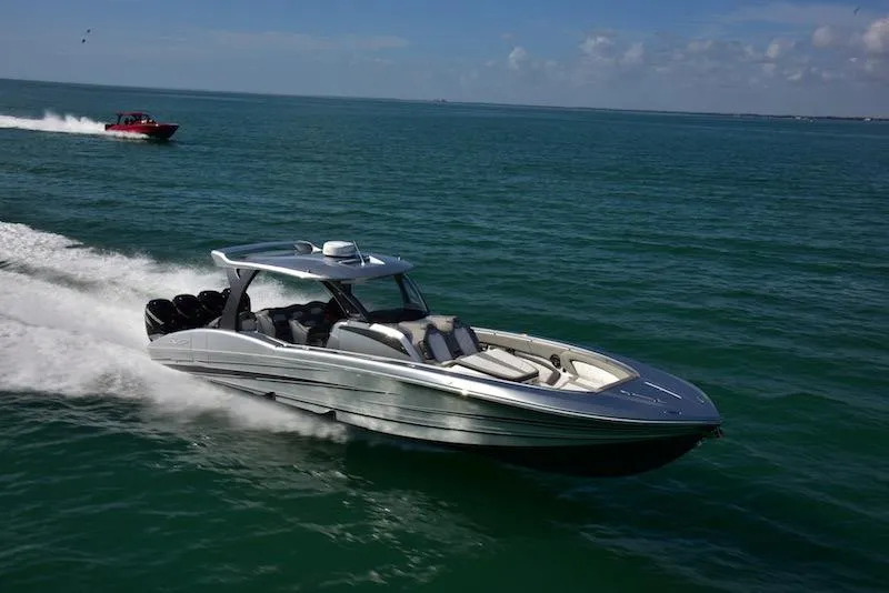 Slide: The Image of 2025 MTI V Marine Technology Inc V 42 speedboat cruising on open water. - 8