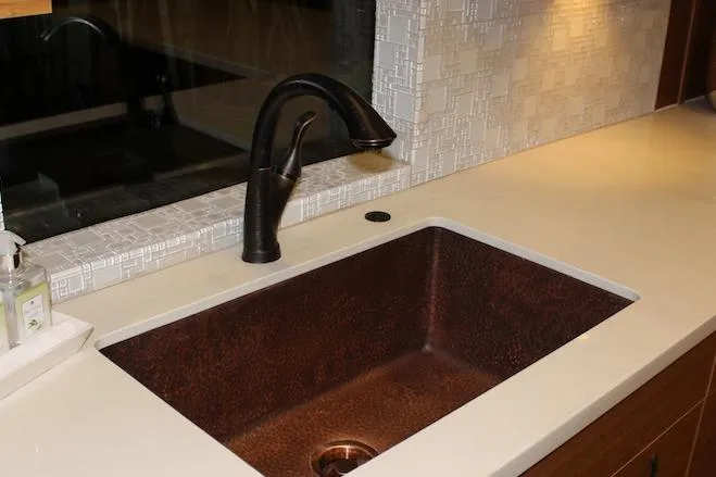 Slide: The Image of Modern kitchen with wood cabinets, white countertop, and decorative artwork. Bravada Infintiy Trip #8, 2014. - 4