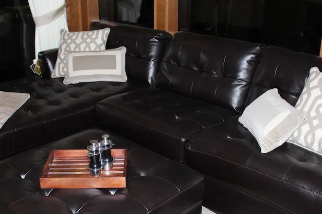 Slide: The Image of Cozy bedroom with abstract art, wooden walls, and patterned pillows in a 2014 Bravada Infinity Trip #8. - 8