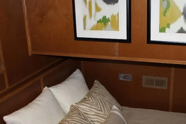 Slide: The Image of Wooden interior of Bravada Infinity Trip #8, featuring a modern sink and cabinetry, 2014 model. - 9