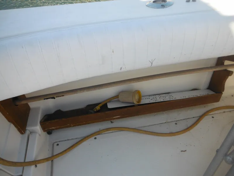 Slide: The Image of 1985 Blackfin 29 Combi boat interior with storage compartment and electrical cable. - 14
