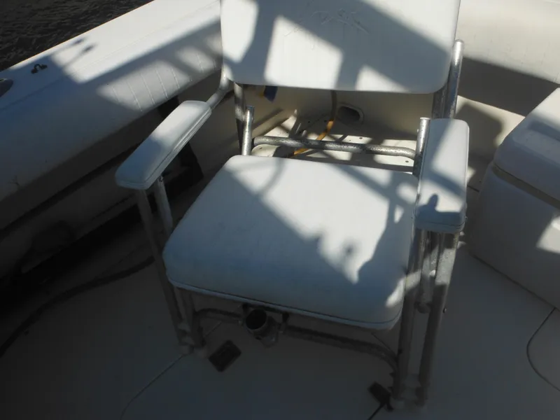 Slide: The Image of White captain's chair on 1985 Blackfin 29 Combi boat. - 15