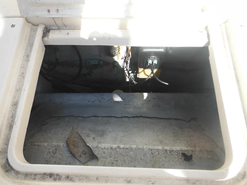 Slide: The Image of 1985 Blackfin 29 Combi engine compartment with visible wiring and components. - 17