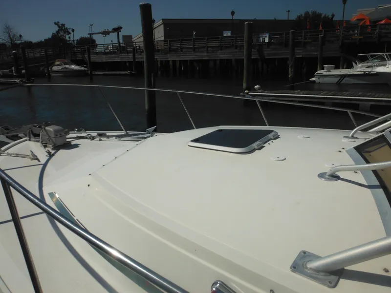 Slide: The Image of 1985 Blackfin 29 Combi boat docked at a marina. - 28