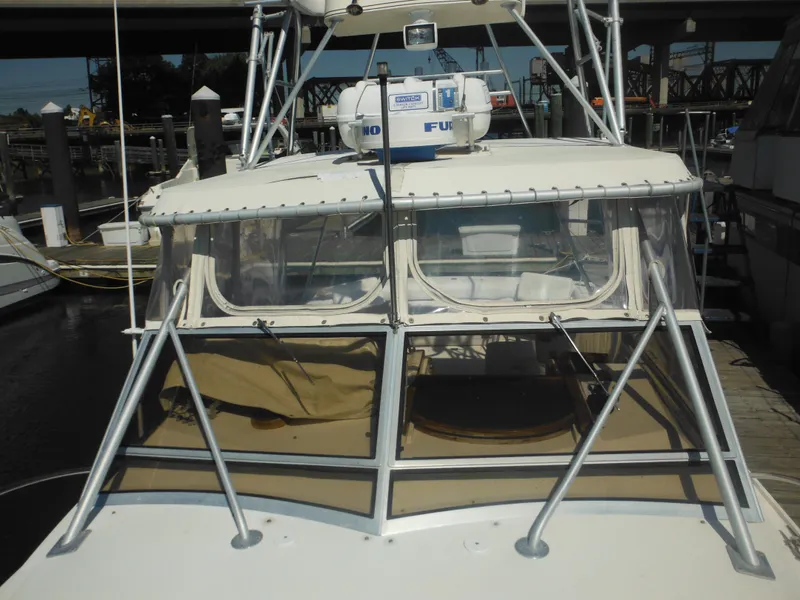 Slide: The Image of 1985 Blackfin 29 Combi boat docked at marina, front view. - 34