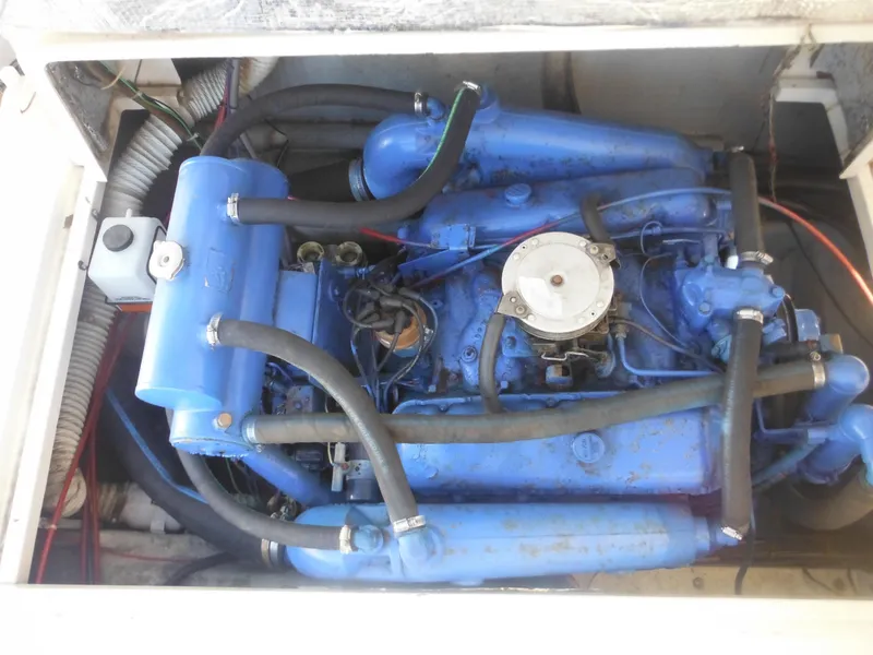 Slide: The Image of 1985 Blackfin 29 Combi engine compartment with blue marine engine. - 38