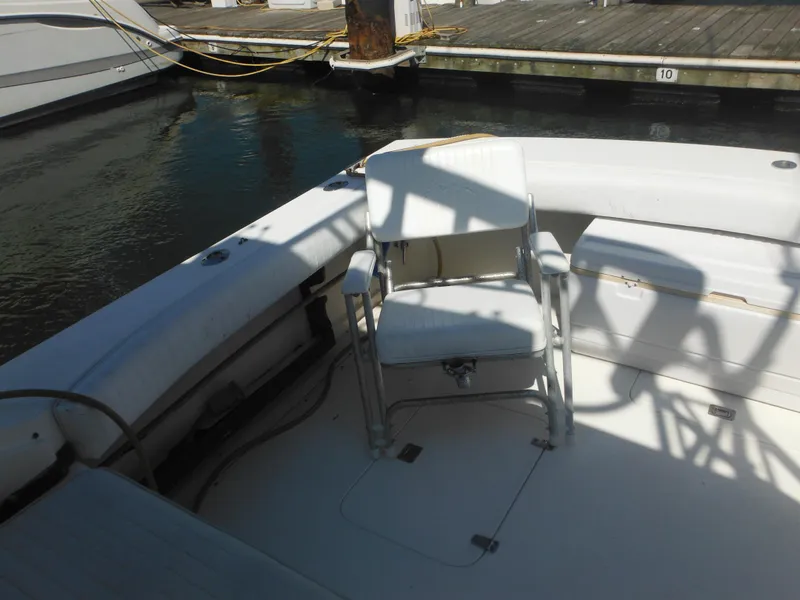 Slide: The Image of 1985 Blackfin 29 Combi boat interior with a single white chair. - 4