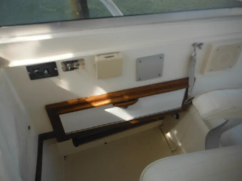 Slide: The Image of Interior view of 1985 Blackfin 29 Combi boat with control panel and seating. - 46