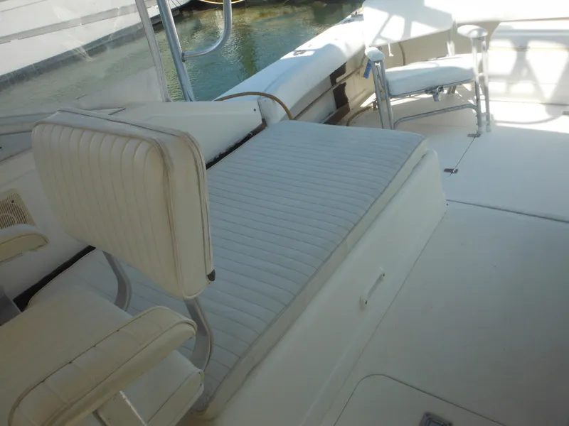 Slide: The Image of Interior seating of 1985 Blackfin 29 Combi boat with white upholstery. - 49