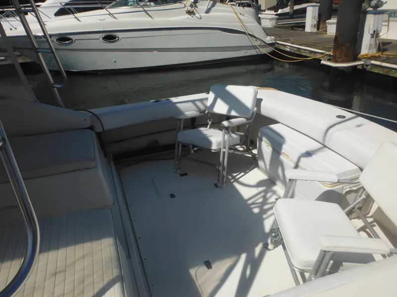 Slide: The Image of 1985 Blackfin 29 Combi boat interior with seating at a marina. - 7
