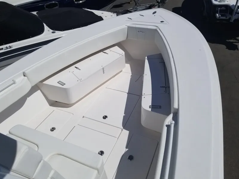 Slide: The Image of 2024 Contender 30 ST boat interior with seating and storage compartments. - 3
