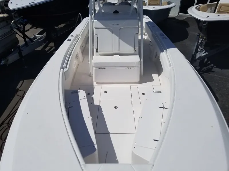 Slide: The Image of 2024 Contender 30 ST boat with spacious deck and seating. - 4