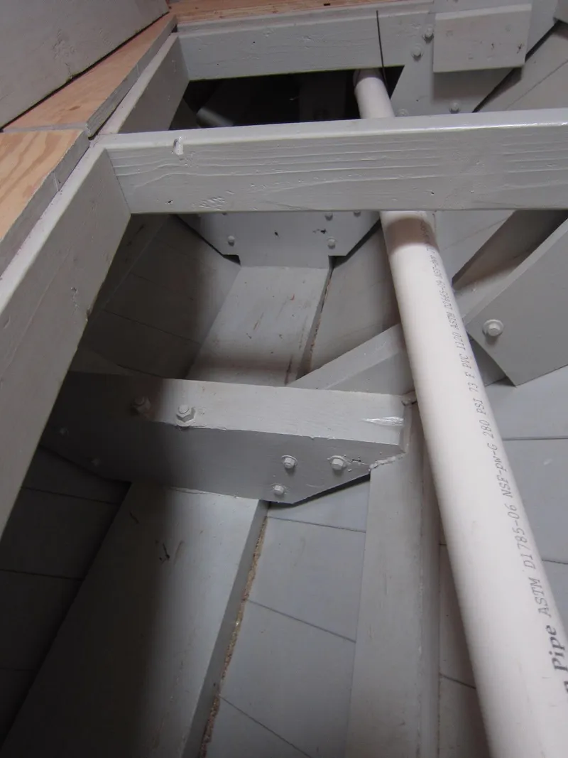 Slide: The Image of Interior view of a 2013 Diesel Duck 40 boat structure with beams and a pipe. - 17